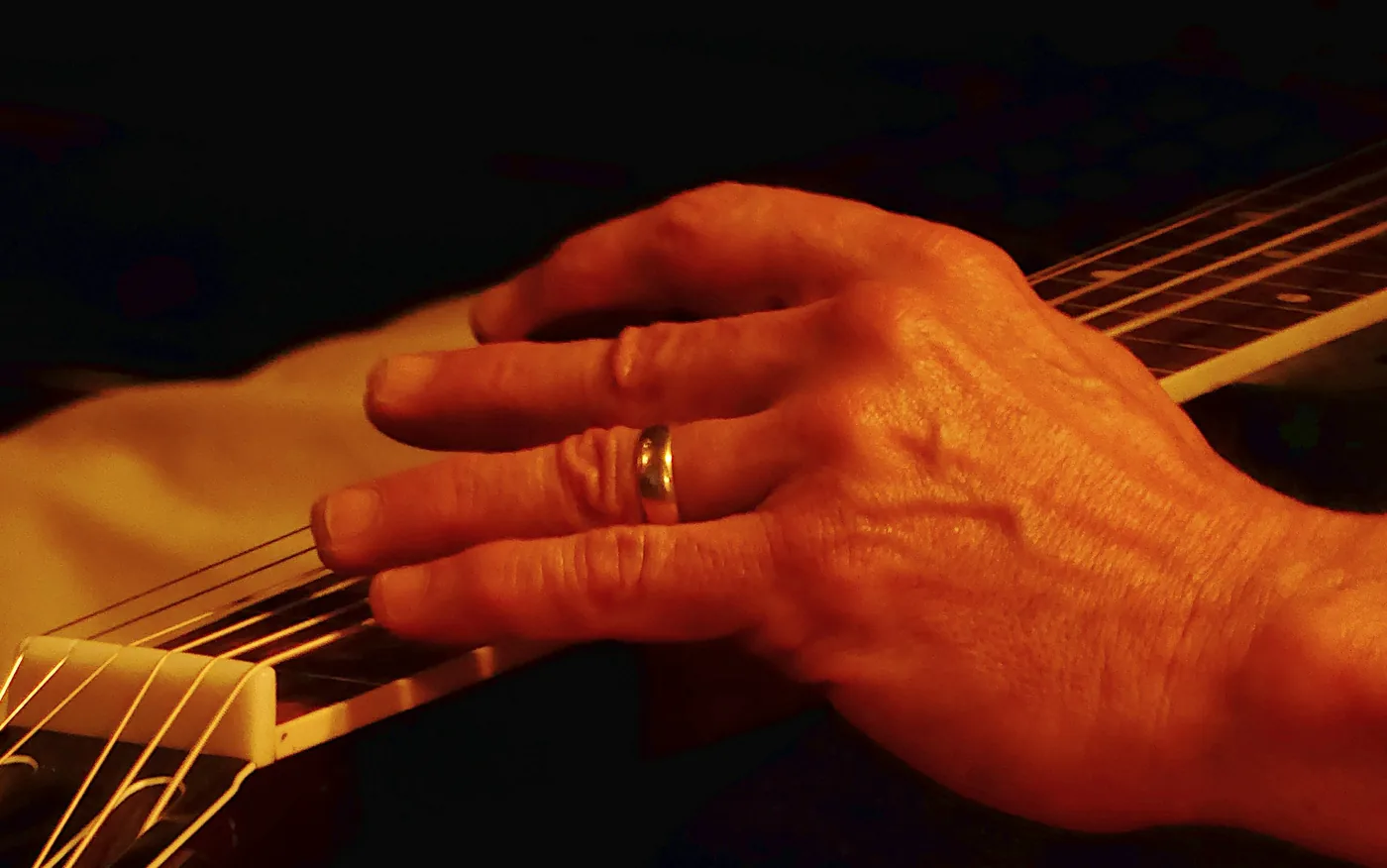 A flamenco guitarist playing on stage